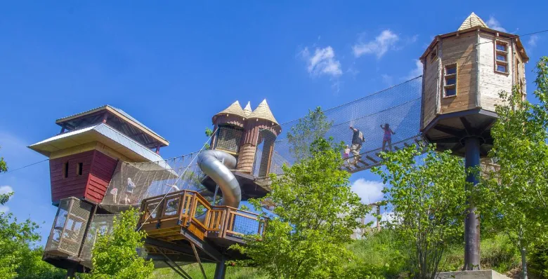 Visitors cross rope bridges and explore towers on Anakeesta’s TreeVenture Course.