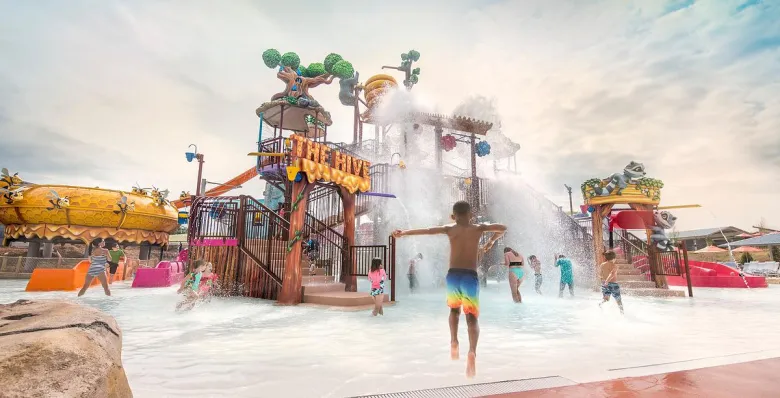 Kids play in the splash zone at The Hive attraction inside Soaky Mountain Waterpark.