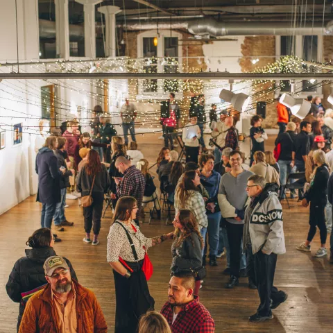 Visitors enjoying a First Friday reception at the Emporium